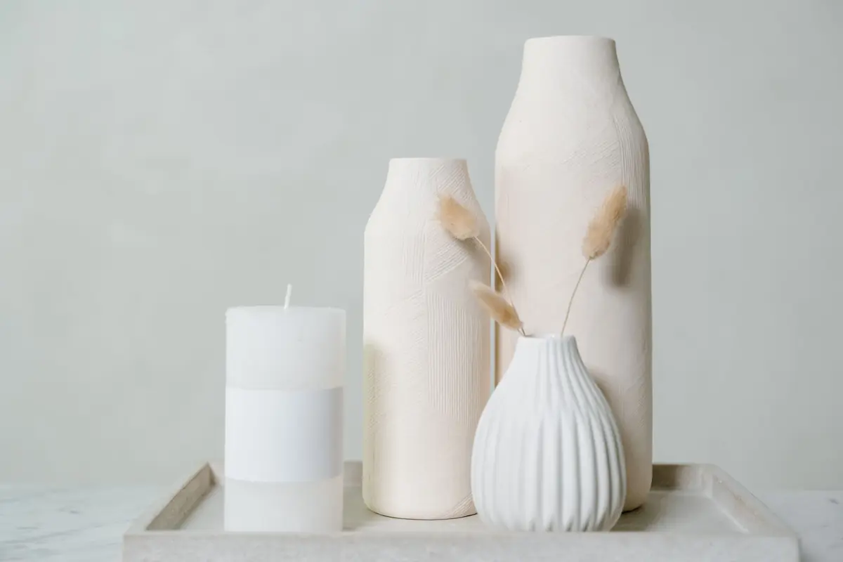 A quiet still life of ceramic vessels in neutral light
